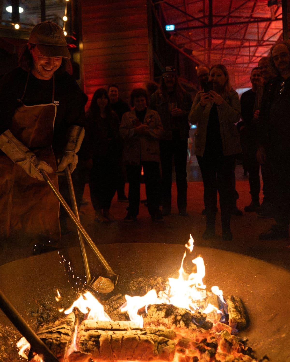 Editorial photo from Stone Brew Day showing the brewing of Stone Beer 2026 (heated-stone porter brewing tradition)