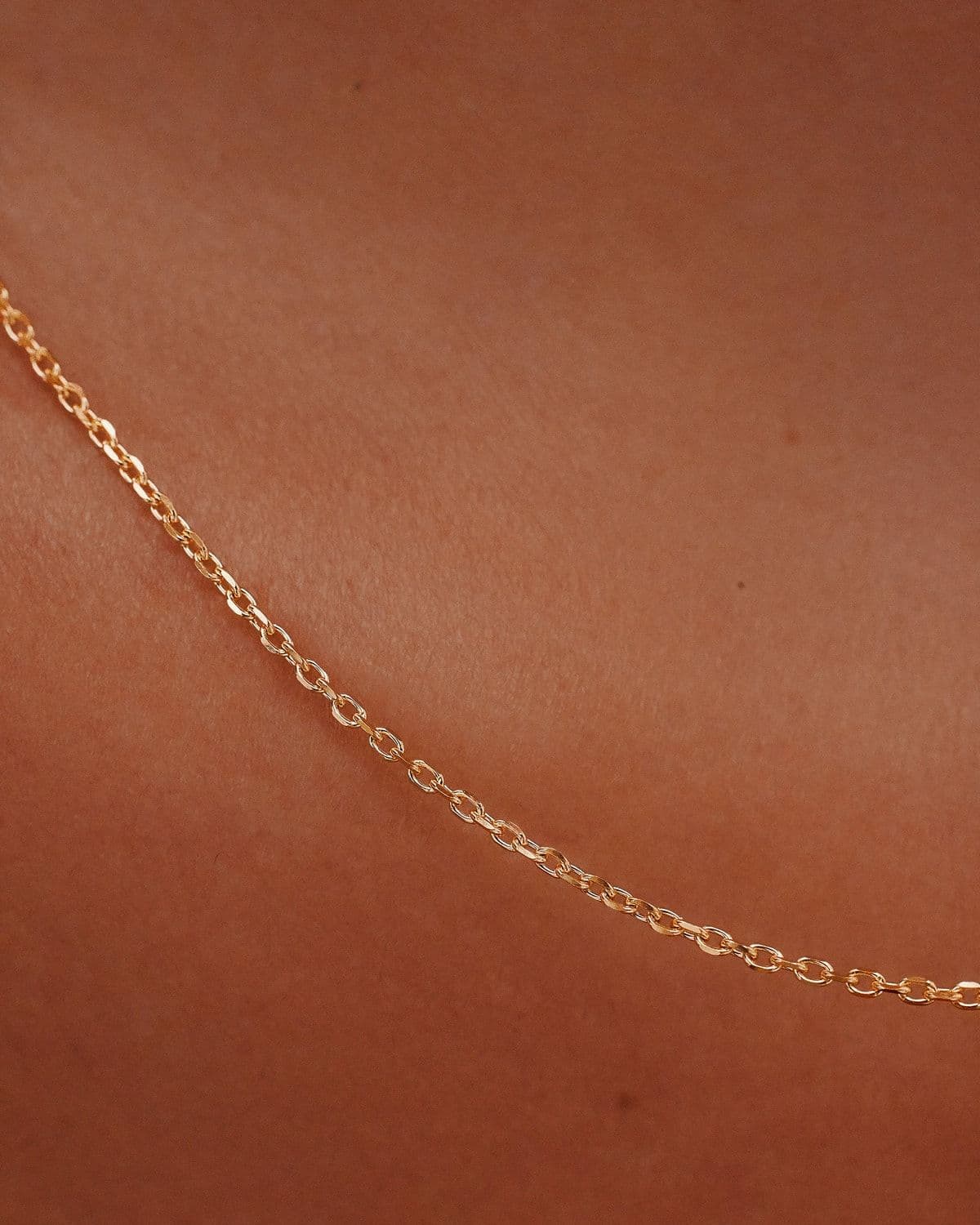 Model wearing yellow gold Bold Chain necklace, lifestyle photography